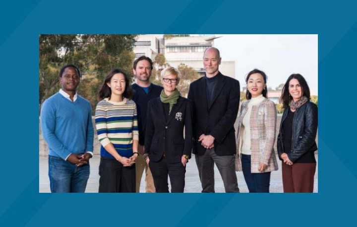 Group photo of the UC San Diego professors who made up the leadership team of the UC San Diego MRSEC center at the start of the six-year $18 million grant over a blue background