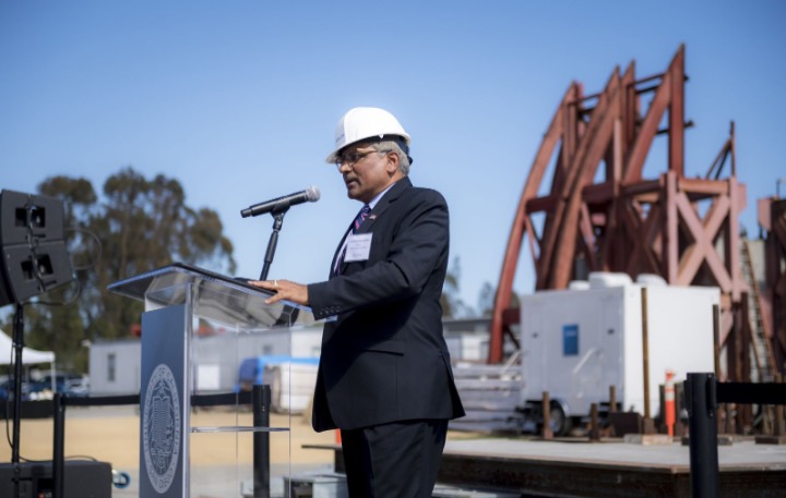 NSF Director Sethuraman Panchanathan stands at a podium as he inaugurates the updated UC San Diego earthquake simulator